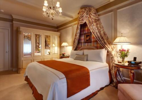 The bedroom of the Presidential Suite honoring Vaclav Havel has a spacious armoire and a king size bed.