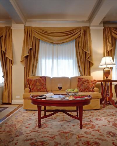 The spacious living room of the Presidential Suite honoring Tennessee Williams features a queen size sofa bed in the living room.