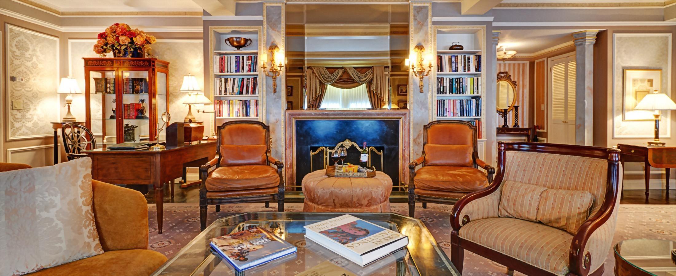 Seating area with faux fireplace in Hotel Elysee Presidential suite
