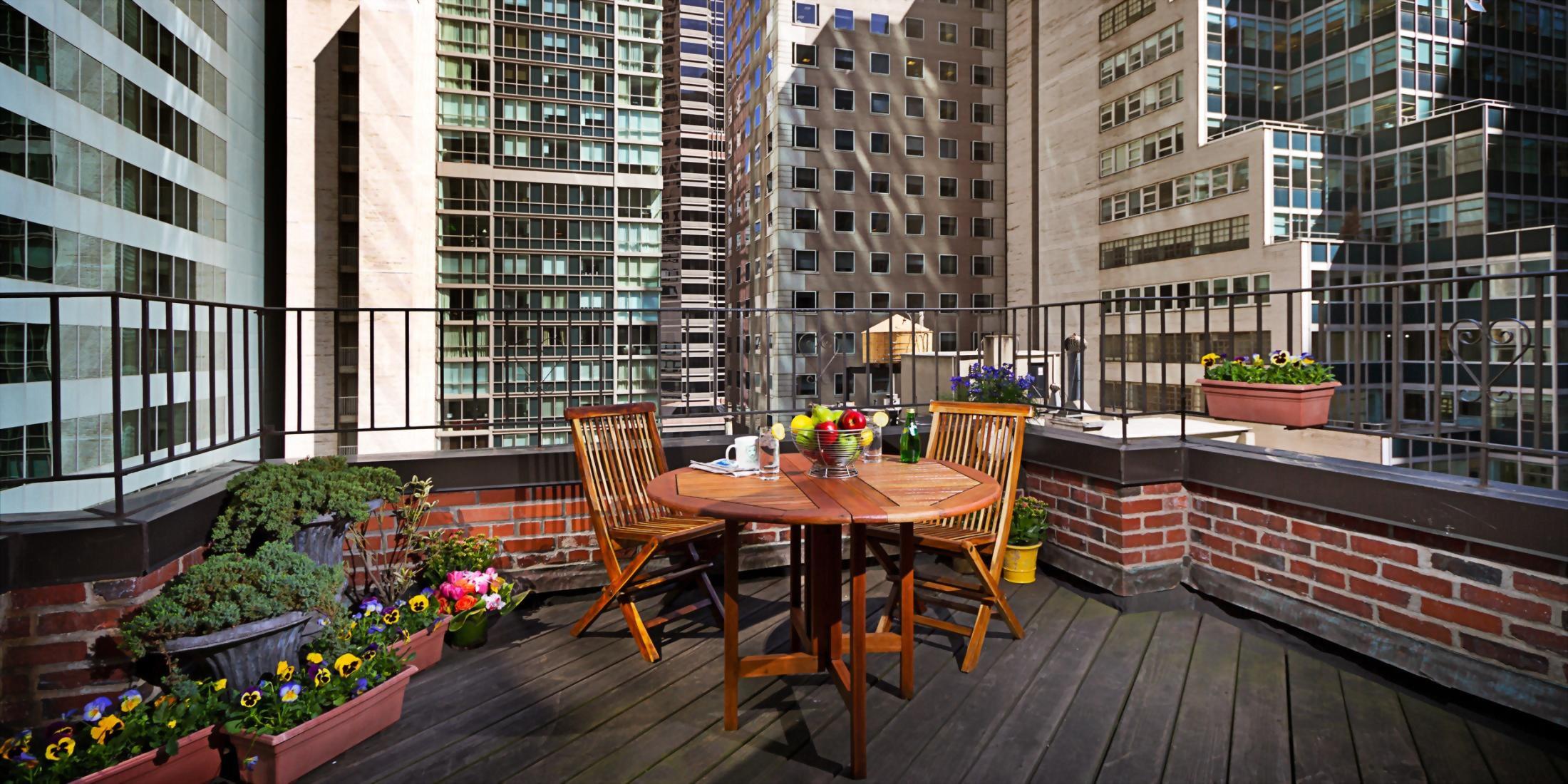 outdoor terrace with  table overlooking midtown Manhattan