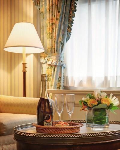 Light and airy front Deluxe Queen Room at the Hotel Elysée.  Amenities can be added to any reservation!  Let us know if you are celebrating.