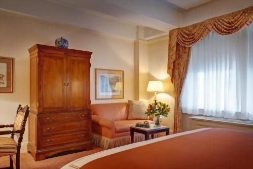 In the Deluxe King room you will find a lovely armoire that houses the flat screen television and DVD player.
