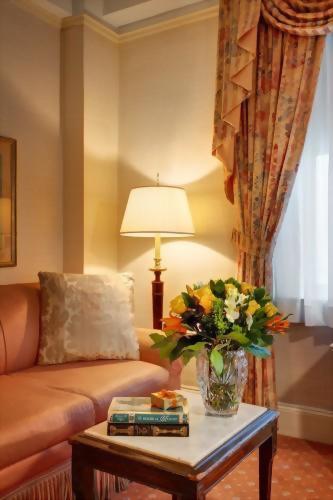 Sitting area of the Deluxe King room at the Hotel Elysee in NYC.  Complete with a couch and coffee table.