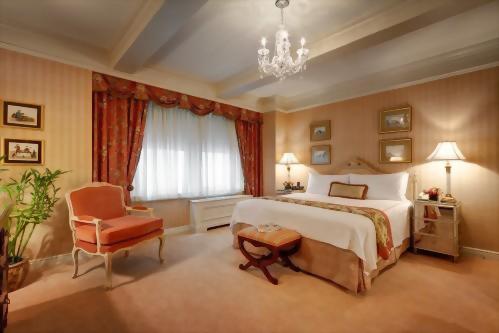 Premier Suites at the Hotel Elysée are a decadent choice for any celebration.  The bedroom of the Parlor Suite is beautifully decorated with a romantic chandelier above the bed.
