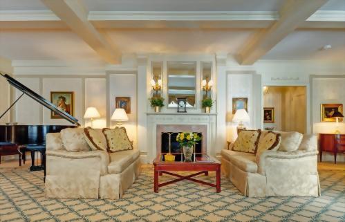 Living room of the Piano Suite features a faux fireplace.